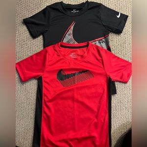 2 Nike Dry Fit shirts. Both are size 6-7